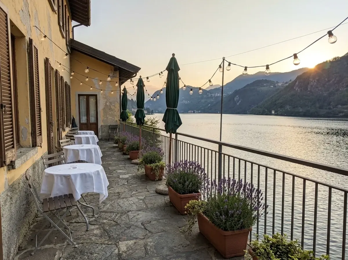The same terrace edited by AI to a summer evening: round tables in white linen, festoon lights, lavender in the planters and low sun over the lake