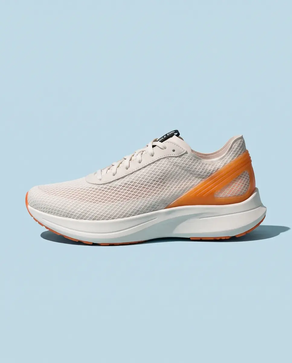 The shoe in exact side profile on a pale ice-blue ground with one crisp shadow beneath it